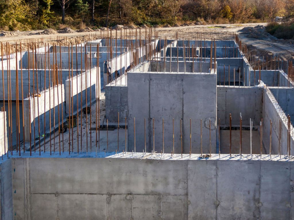 Concrete foundation walls with steel rebar at construction site
