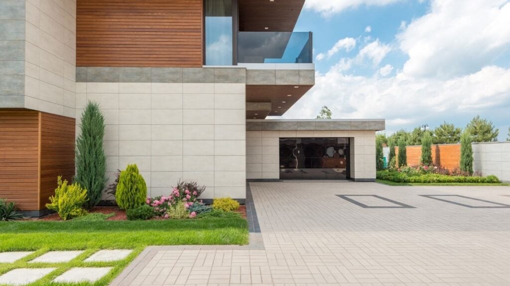 ontemporary Home Entrance with Paver Driveway and Garden