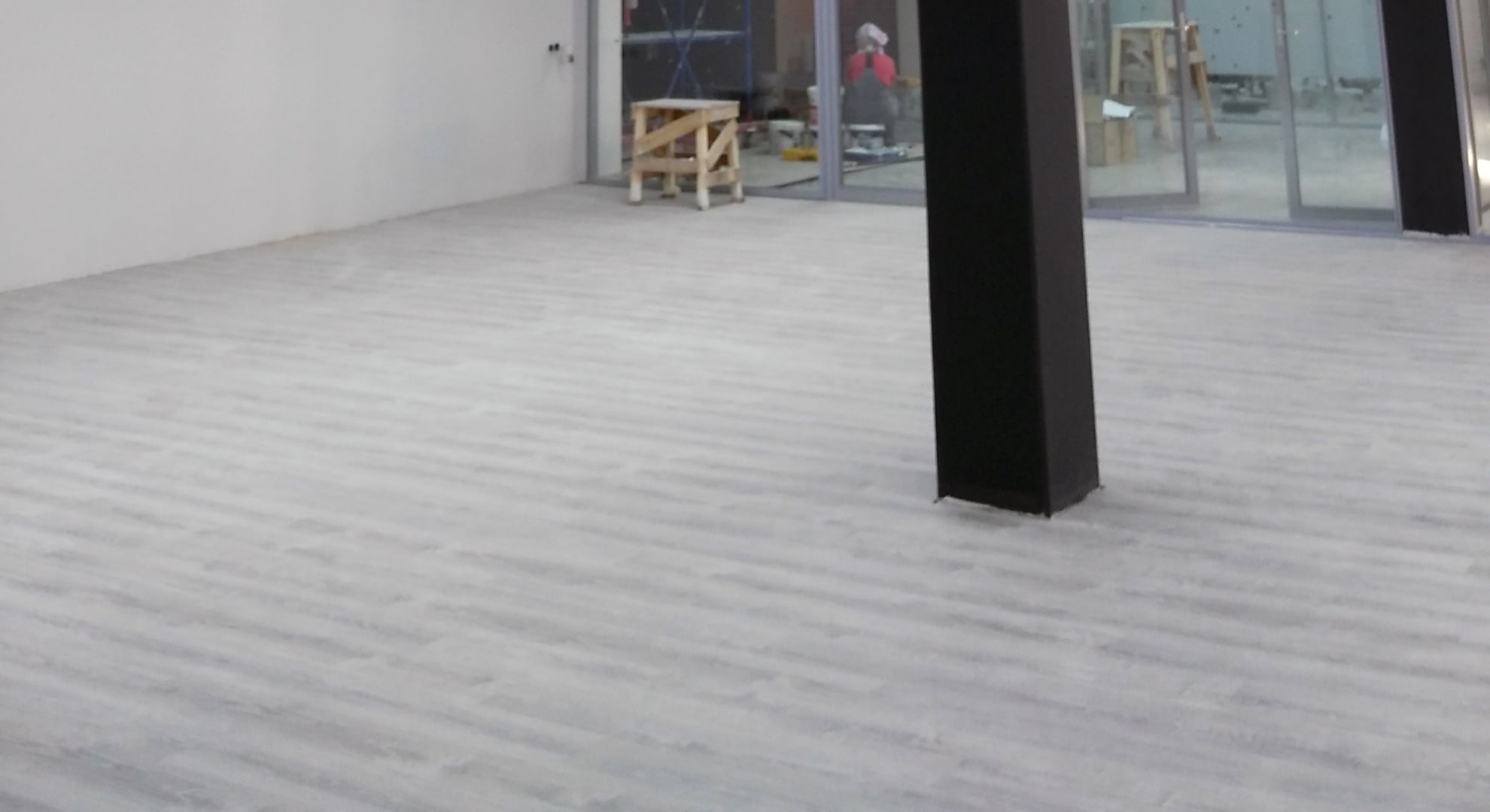 an empty room with customised concrete flooring