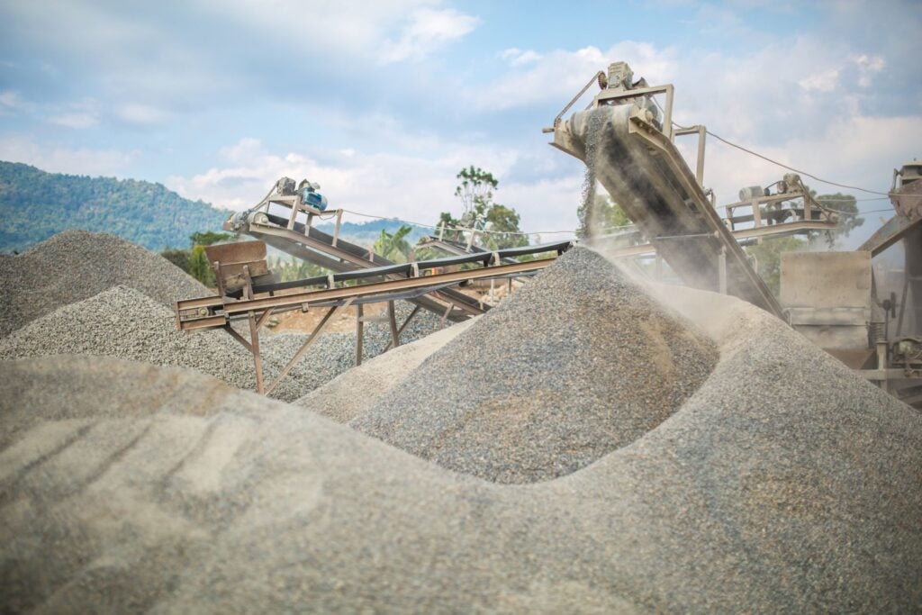 Conveyor belts sorting gravel at quarry site