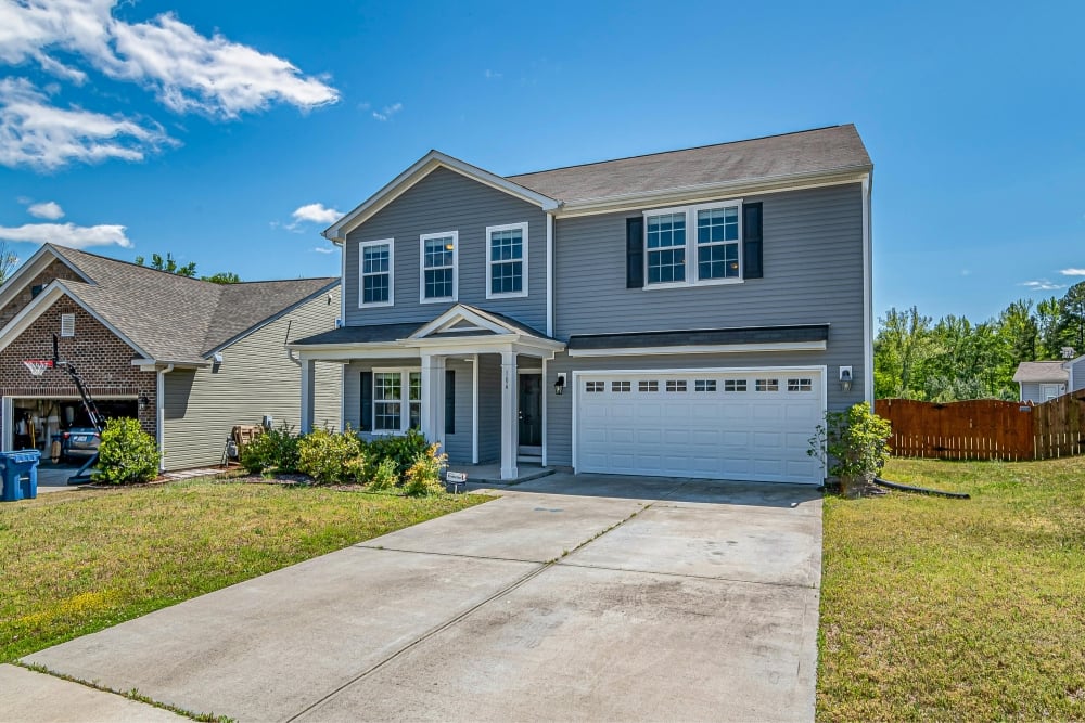 Two-storey suburban home with double garage and driveway