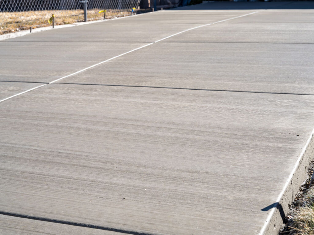 Newly poured concrete driveway with expansion joints