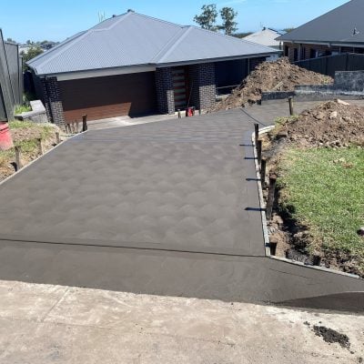 Freshly poured concrete driveway at suburban home