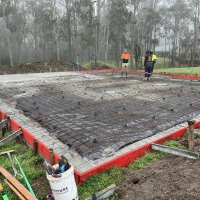 Concrete slab pour with steel reinforcement in bushland
