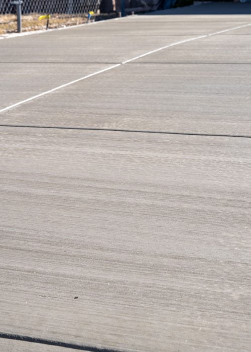 Newly poured concrete driveway with expansion joints